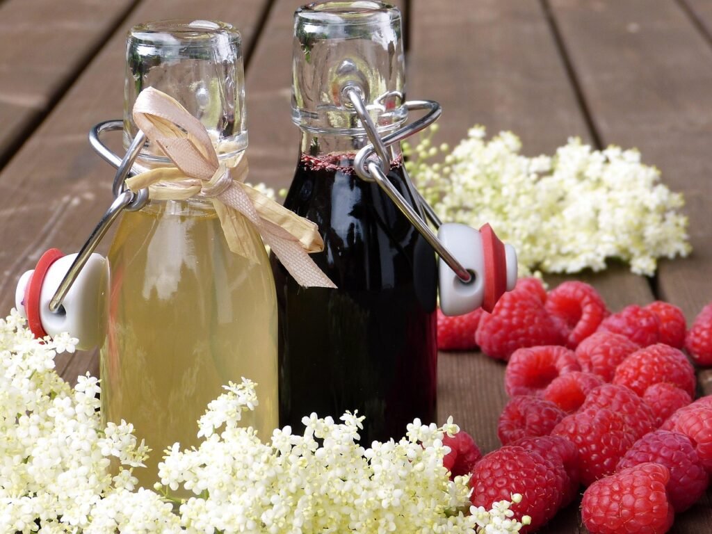 bottles, raspberries, syrup, drink, blossoms, elderberry syrup, raspberry syrup, homemade, gift, invitation, summer party, outdoors, healthy, sugar, sambucus nigra, remedies, fresh, detox
