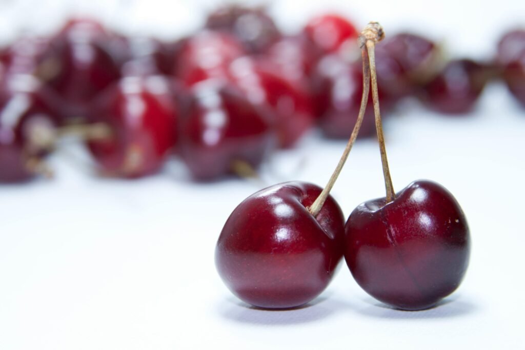 Vibrant close-up of fresh red cherries showcasing their juicy and sweet appearance.